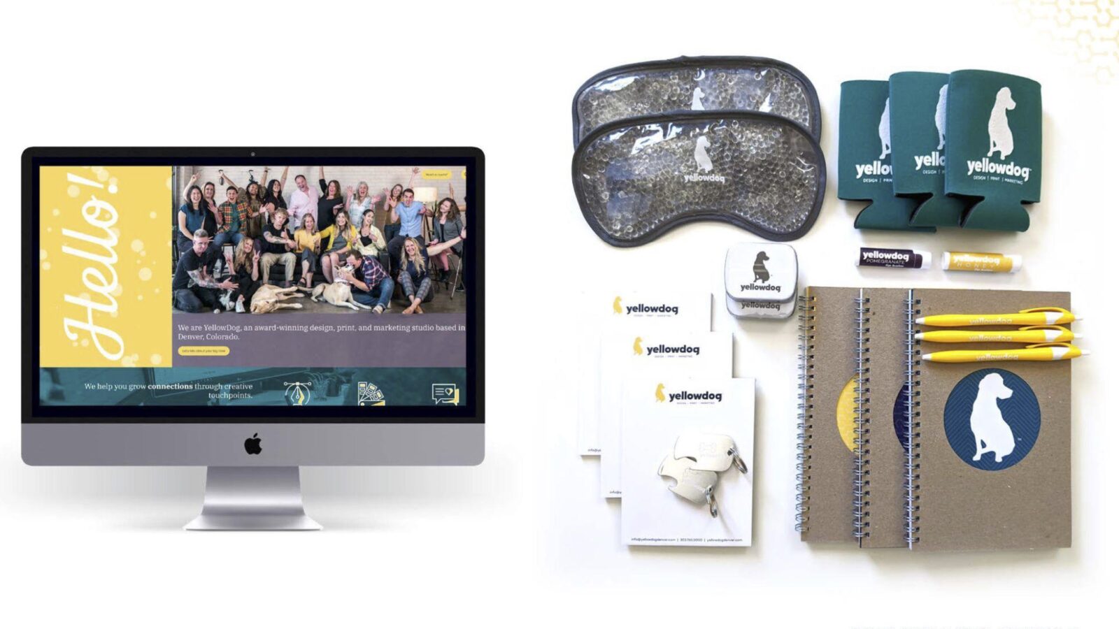Desktop computer monitor showing YellowDog home page alongside branded swag (coozies, eye masks, dog tags, notebooks and pens)