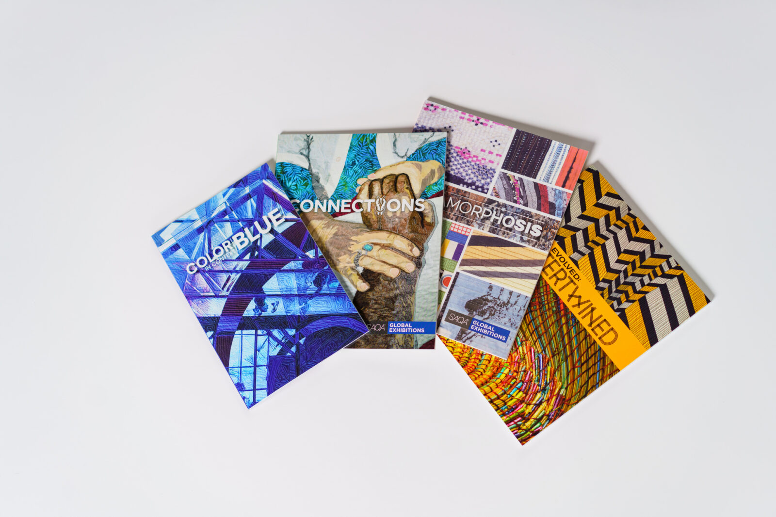 Four fine-art magazines demonstrating the impact of full-bleed art in print.