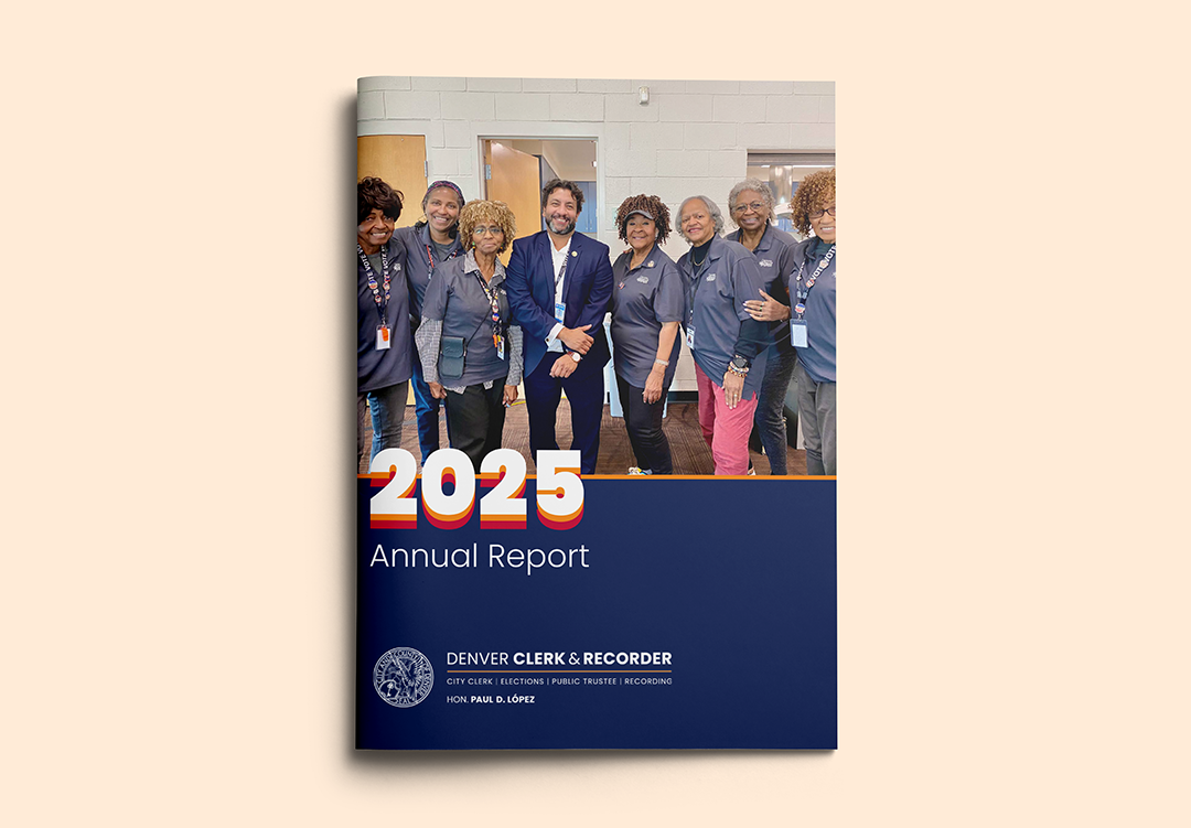 Annual report design example: front cover of a booklet featuring a photo of a man in a navy sport jacket posing with seven women wearing grey polo shirts and name badges. The words "2025 Annual Report - Denver Clerk & Recorder - City Clerk | Elections | Public Trustee | Recording | Hon. Paul D. Lopez" are at the bottom.