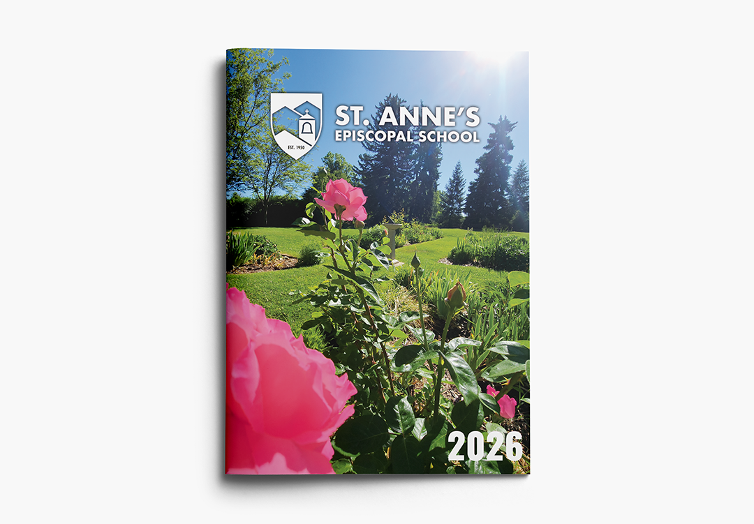 Report design front cover example featuring a full-bleed photo of a rose garden and the words "St. Anne's Episcopal School 2026."